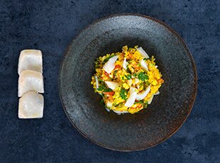 Risotto allo zafferano con baccalà norvegese, peperoni e paprika