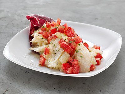 Terrina di Stoccafisso di Norvegia con patate, pomodorini e limone nella lattuga gratin